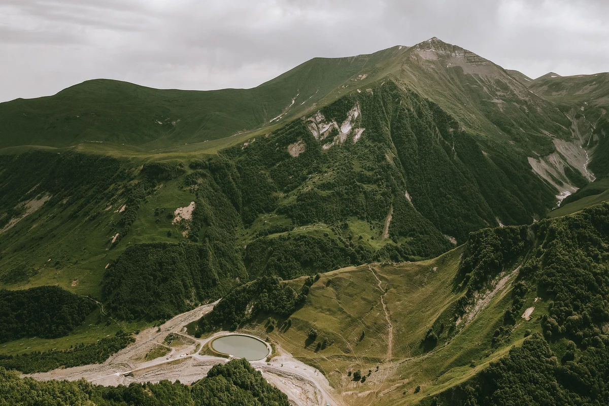 Rugged mountain ridges of Mtskheta-Mtianeti region in Georgia — the dramatic highland terrain trekkers traverse on the Omalo to Shatili route through Khevsureti