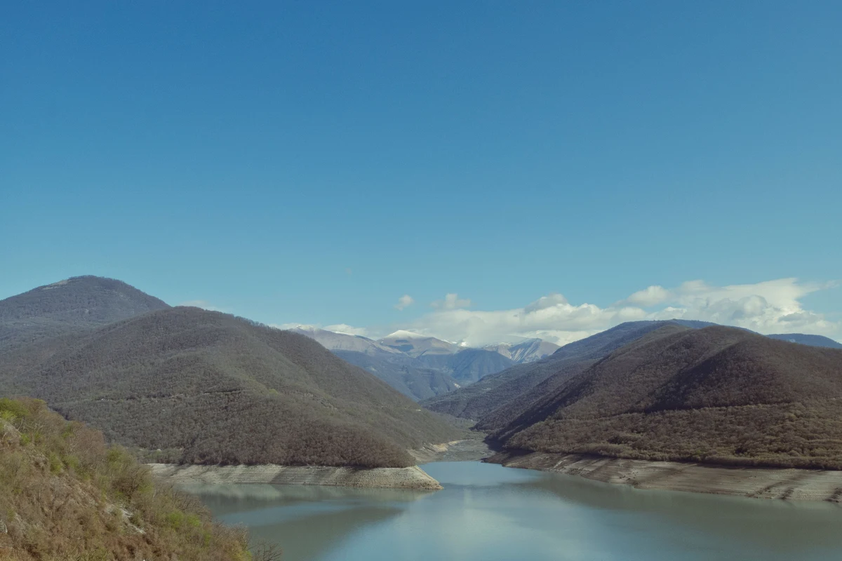Pristine mountain lake surrounded by peaks in the Ananuri area of Mtskheta-Mtianeti, Georgia — the type of remote alpine lake scenery found at Udziro Lake in Racha